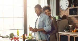 Loving couple happy cooking together at home