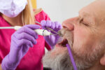 Man having his teeth examined