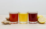 A selection of colorful kombuchas in clear glasses