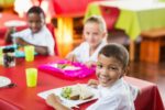 Children eating together at school