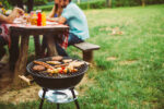 Barbecue grill and picnic table outside