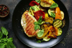 Plate of grilled chicken and roasted vegetables