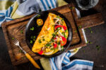 Healthy omelet in a cast iron skillet