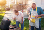 Family having fun grilling outside together