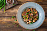 Bowl of mushrooms with herbs