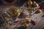 Olive oil and olives in glass bowls