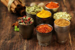 small pots of colorful spices