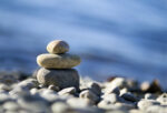 meditation stones against ocean background