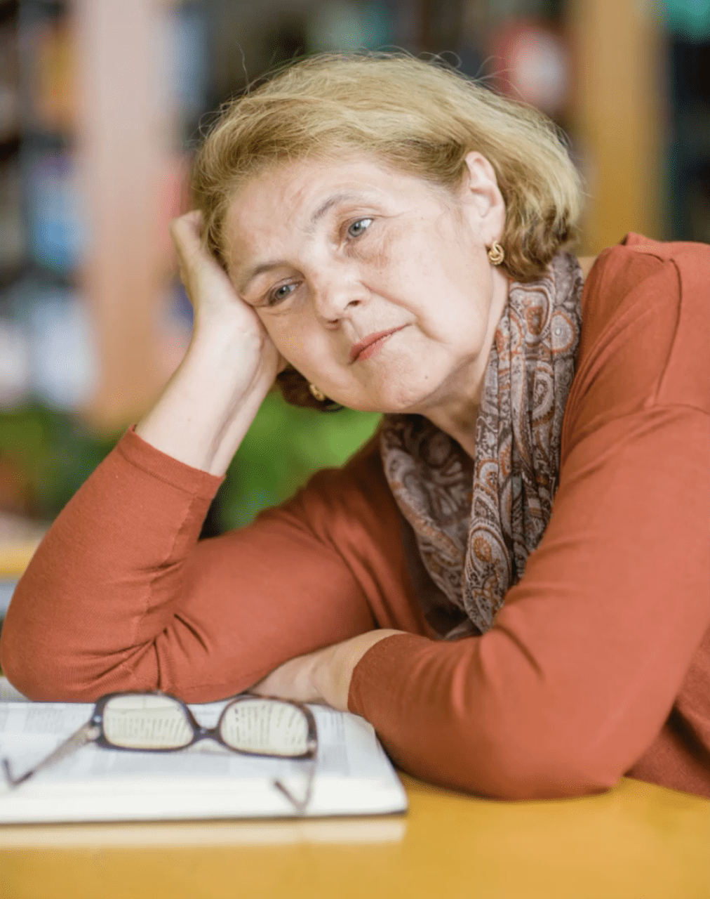 Image of tired woman starting into space.