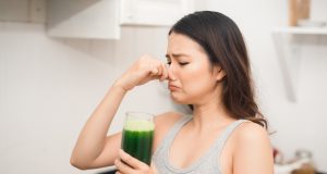 Woman does not like drinking health shake